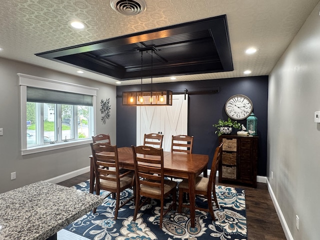 10 Goulet St, Lewiston, ME 04240 - dining space featuring a barn door, dark wood-style flooring, and recessed lighting