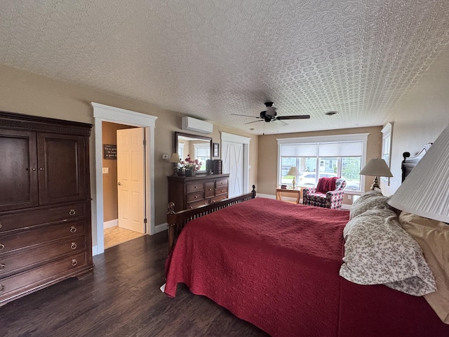 10 Goulet St, Lewiston, ME 04240 - bedroom with a wall mounted AC, dark wood-style flooring, and ceiling fan
