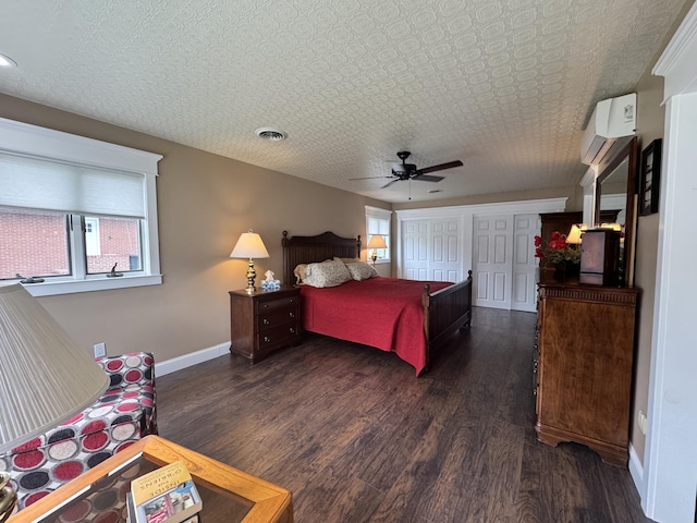 10 Goulet St, Lewiston, ME 04240 - bedroom with a wall mounted air conditioner, multiple windows, dark wood-type flooring, and ceiling fan