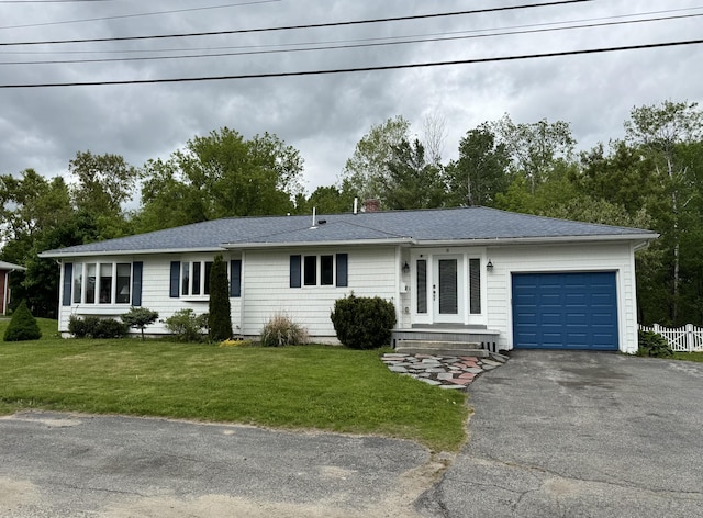 10 Goulet St, Lewiston, ME 04240 - ranch-style home featuring asphalt driveway, an attached garage, a front lawn, and a shingled roof