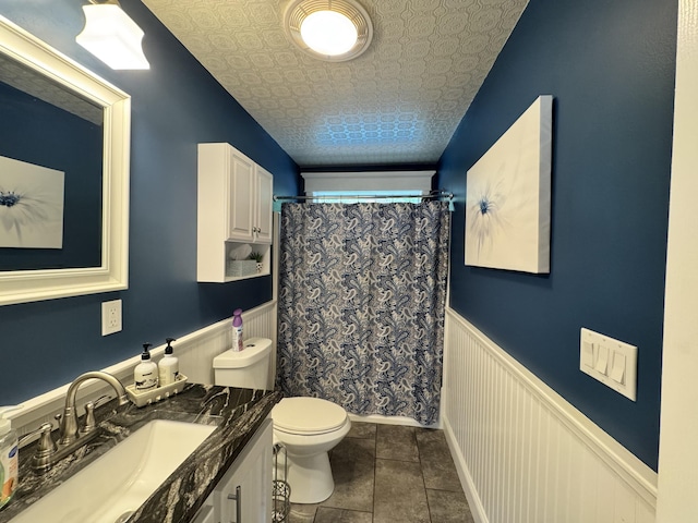 10 Goulet St, Lewiston, ME 04240 - full bath featuring vanity, wainscoting, a shower with curtain, tile patterned flooring, and an ornate ceiling