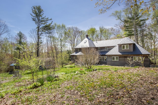 121 Heal Rd, Lincolnville, ME 04849 - view of side of home featuring a chimney