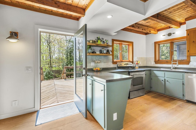 121 Heal Rd, Lincolnville, ME 04849 - kitchen with stainless steel appliances, a sink, beam ceiling, dark countertops, and wood ceiling