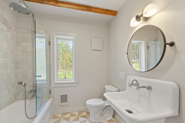 121 Heal Rd, Lincolnville, ME 04849 - full bathroom with baseboards, beamed ceiling, toilet, a sink, and heating unit