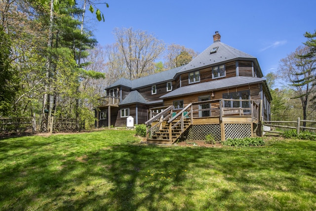 121 Heal Rd, Lincolnville, ME 04849 - rear view of house featuring stairs, a chimney, and a deck