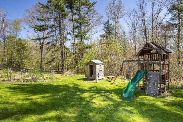 121 Heal Rd, Lincolnville, ME 04849 - view of green lawn featuring a shed, a playground, and an outdoor structure
