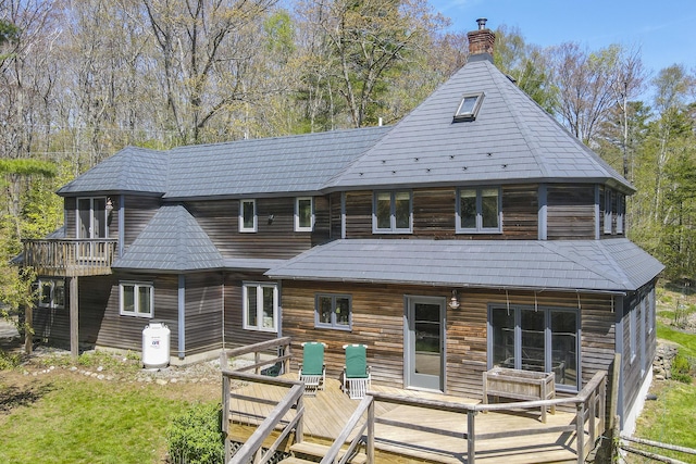 121 Heal Rd, Lincolnville, ME 04849 - back of property with a wooden deck and a chimney