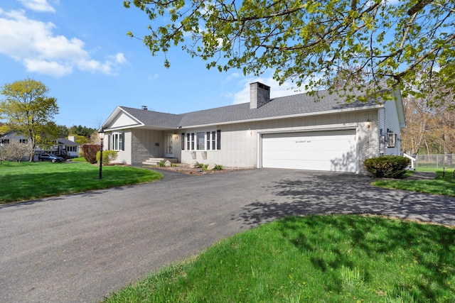 164 Dewitt Ave, Bangor, ME 04401 - ranch-style home featuring driveway, a chimney, brick siding, and an attached garage