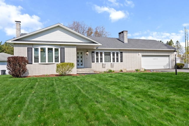 164 Dewitt Ave, Bangor, ME 04401 - back of house featuring a chimney, brick siding, an attached garage, and a lawn