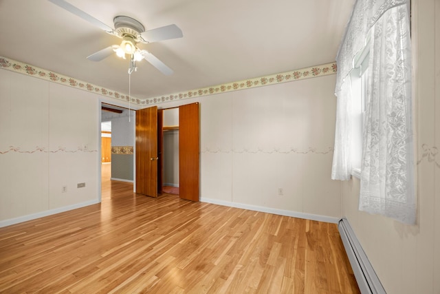164 Dewitt Ave, Bangor, ME 04401 - empty room featuring a baseboard radiator, light wood-style flooring, ceiling fan, and baseboards