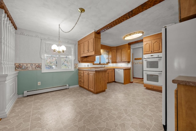 164 Dewitt Ave, Bangor, ME 04401 - kitchen with a baseboard radiator, white appliances, stone floors, a chandelier, and a peninsula