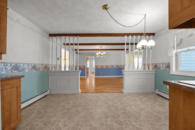 164 Dewitt Ave, Bangor, ME 04401 - kitchen featuring a chandelier, a baseboard heating unit, stone flooring, wainscoting, and dark countertops