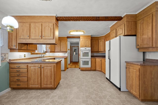 164 Dewitt Ave, Bangor, ME 04401 - kitchen with white appliances, a peninsula, brown cabinets, baseboards, and light stone finish floors