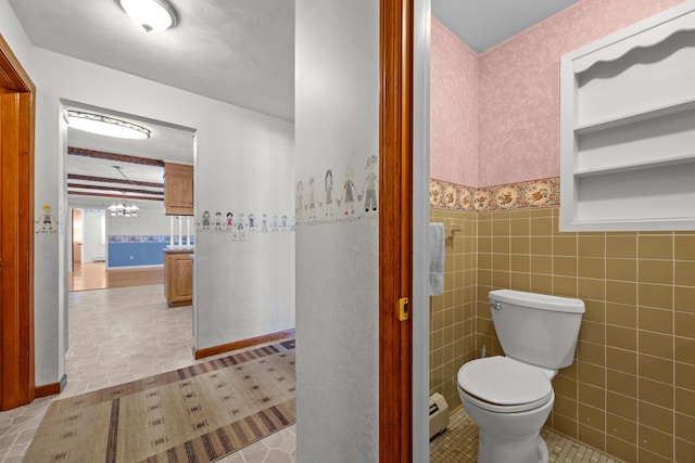 164 Dewitt Ave, Bangor, ME 04401 - bathroom featuring toilet, tile patterned flooring, wallpapered walls, and a wainscoted wall