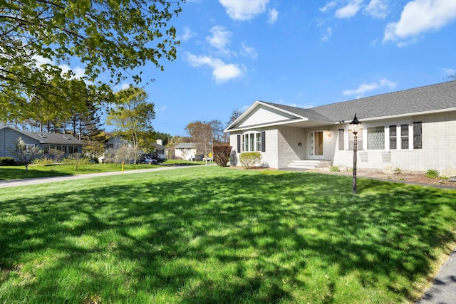 164 Dewitt Ave, Bangor, ME 04401 - view of side of home with brick siding and a lawn