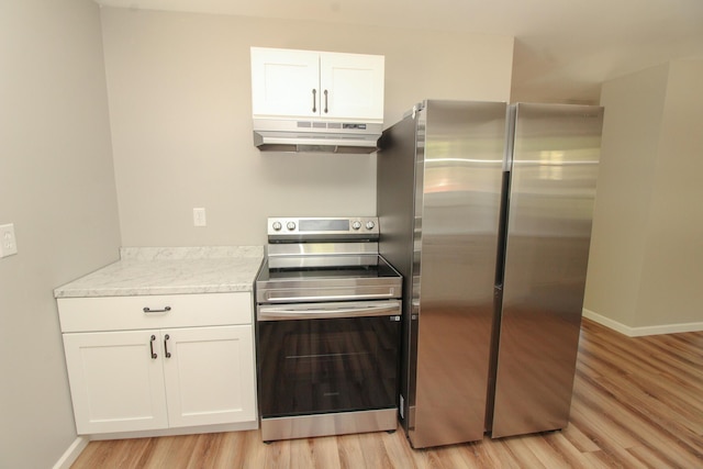 342 Spring Bridge Rd, Greenbush, ME 04418 - kitchen featuring under cabinet range hood, appliances with stainless steel finishes, light wood-style floors, white cabinets, and baseboards