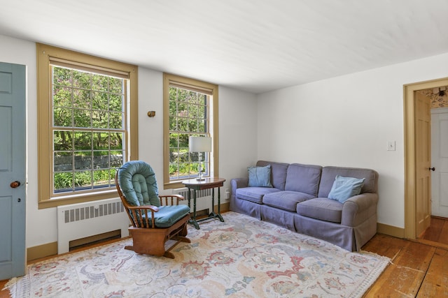 42 Winthrop St, Hallowell, ME 04347 - living room with hardwood / wood-style floors, plenty of natural light, and radiator heating unit