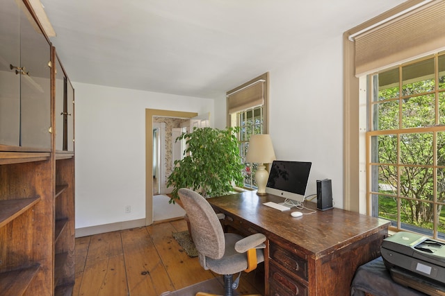 42 Winthrop St, Hallowell, ME 04347 - home office featuring hardwood / wood-style flooring, healthy amount of natural light, and baseboards