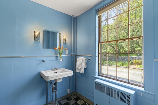 42 Winthrop St, Hallowell, ME 04347 - bathroom with radiator heating unit, healthy amount of natural light, wainscoting, and a sink