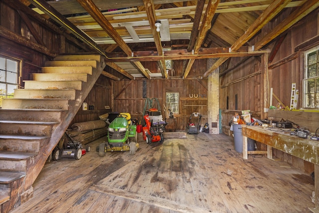 42 Winthrop St, Hallowell, ME 04347 - miscellaneous room featuring wood-type flooring, stairs, and wooden walls
