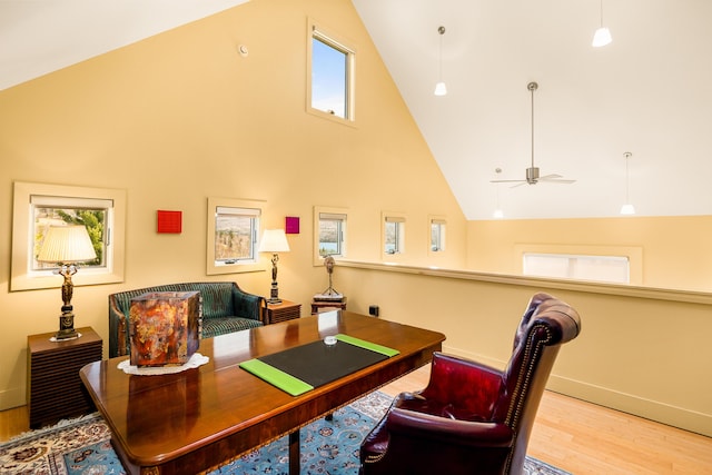39 Kendall Farm Trl, Rangeley, ME 04970 - home office with high vaulted ceiling, wood finished floors, and ceiling fan