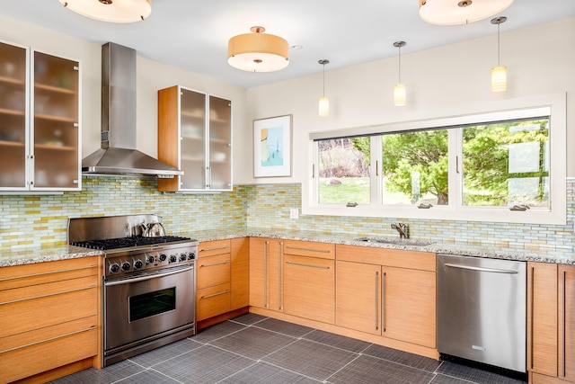 39 Kendall Farm Trl, Rangeley, ME 04970 - kitchen featuring stainless steel appliances, wall chimney exhaust hood, backsplash, and hanging light fixtures
