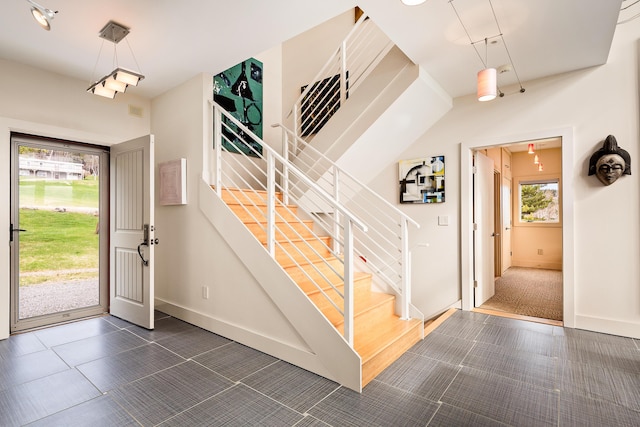 39 Kendall Farm Trl, Rangeley, ME 04970 - tiled foyer with stairs