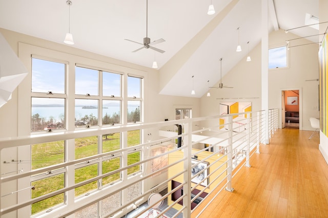 39 Kendall Farm Trl, Rangeley, ME 04970 - corridor featuring high vaulted ceiling, light wood-style flooring, beamed ceiling, and an upstairs landing