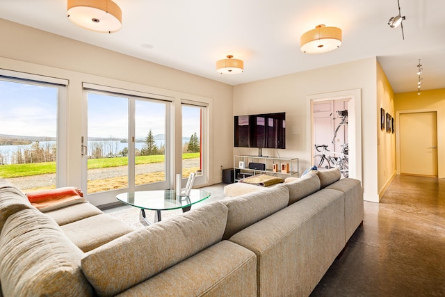 39 Kendall Farm Trl, Rangeley, ME 04970 - living area with baseboards and concrete flooring
