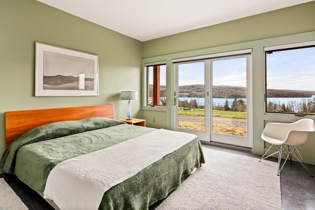 39 Kendall Farm Trl, Rangeley, ME 04970 - carpeted bedroom featuring access to exterior and a water view