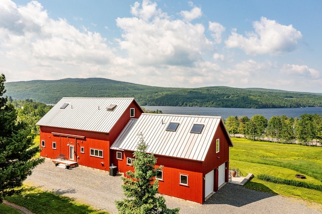 39 Kendall Farm Trl, Rangeley, ME 04970 - view of subject property with a forest and a large body of water