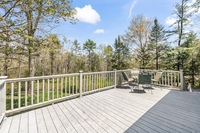 deck featuring outdoor dining area