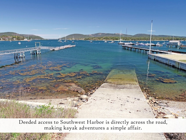 dock featuring a water and mountain view