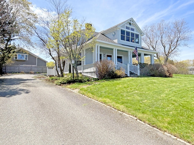 view of front of property with covered porch and a chimney