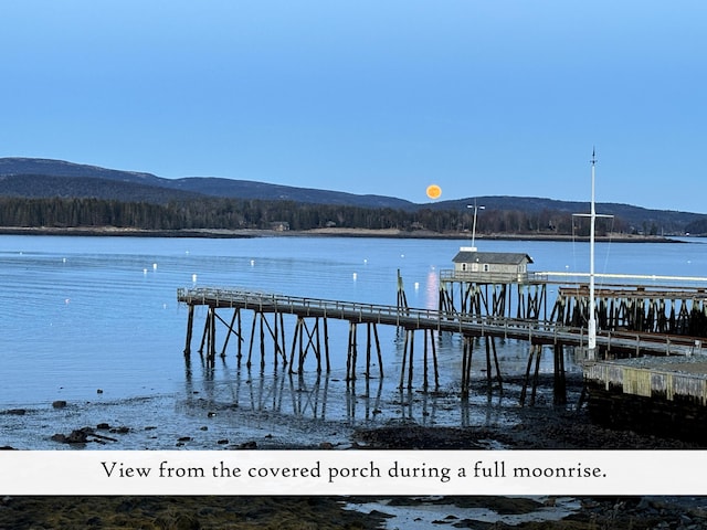 dock featuring a water and mountain view