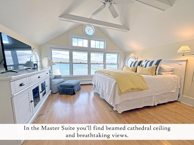 bedroom featuring light wood-style floors, a water view, a ceiling fan, and a baseboard radiator