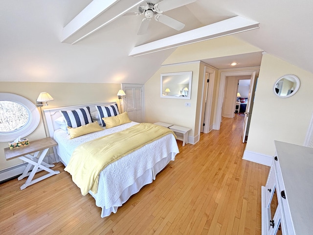 bedroom featuring lofted ceiling, light wood-style flooring, baseboards, and ceiling fan