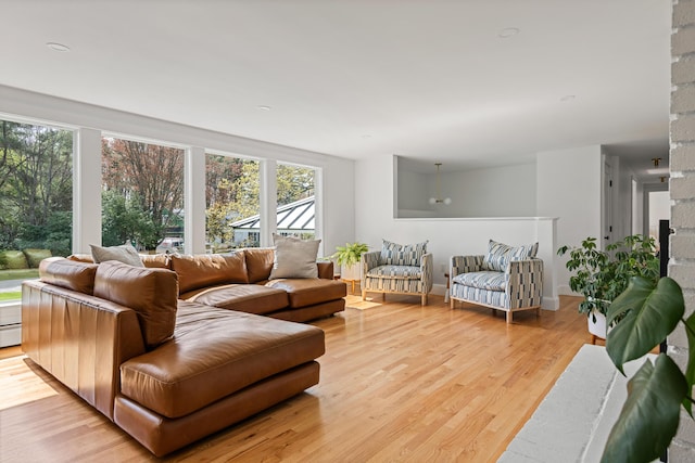 56 Carroll St, Falmouth, ME 04105 - living area with light wood-style floors and baseboard heating