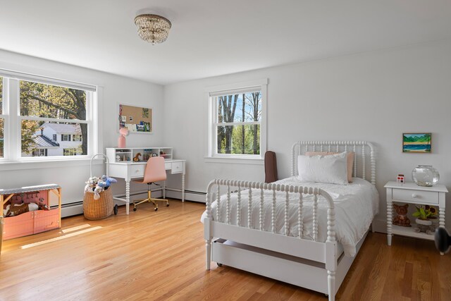 56 Carroll St, Falmouth, ME 04105 - bedroom featuring light wood-style floors and baseboard heating