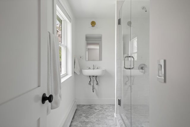 56 Carroll St, Falmouth, ME 04105 - bathroom featuring a stall shower, baseboards, and healthy amount of natural light