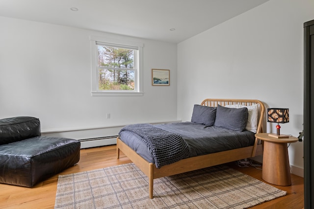 56 Carroll St, Falmouth, ME 04105 - bedroom with a baseboard heating unit and wood finished floors