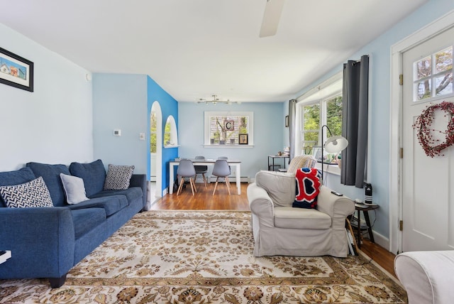 38 Falmouth Rd, Falmouth, ME 04105 - living area featuring wood finished floors and a baseboard heating unit