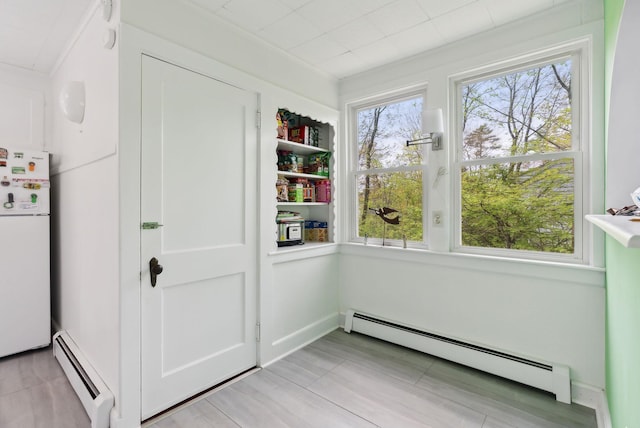 38 Falmouth Rd, Falmouth, ME 04105 - unfurnished sunroom with a baseboard heating unit