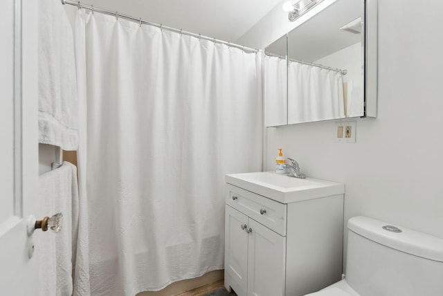 38 Falmouth Rd, Falmouth, ME 04105 - bathroom with vanity, toilet, and a shower with shower curtain