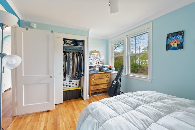 38 Falmouth Rd, Falmouth, ME 04105 - bedroom with crown molding, wood finished floors, a closet, and ceiling fan
