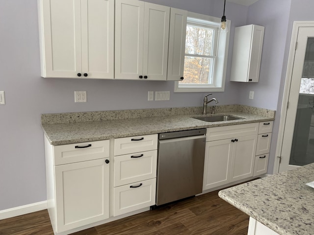 kitchen with stainless steel dishwasher, a sink, white cabinetry, and dark wood-style floors