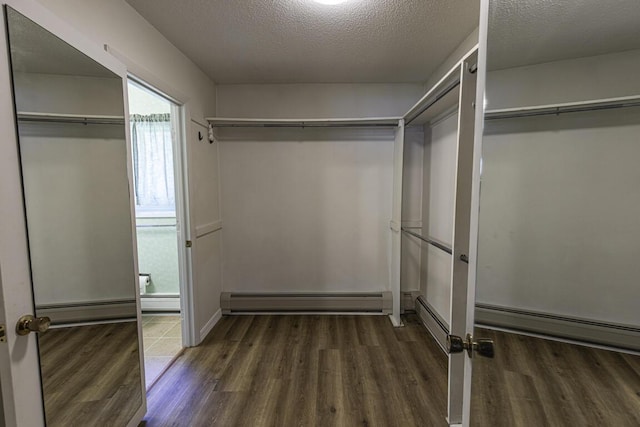 29 Fields Pond Rd, Holden, ME 04429 - spacious closet with a baseboard radiator and wood finished floors