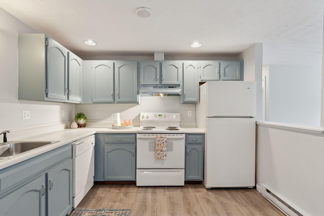kitchen with white appliances, under cabinet range hood, a baseboard radiator, light wood-type flooring, and a sink