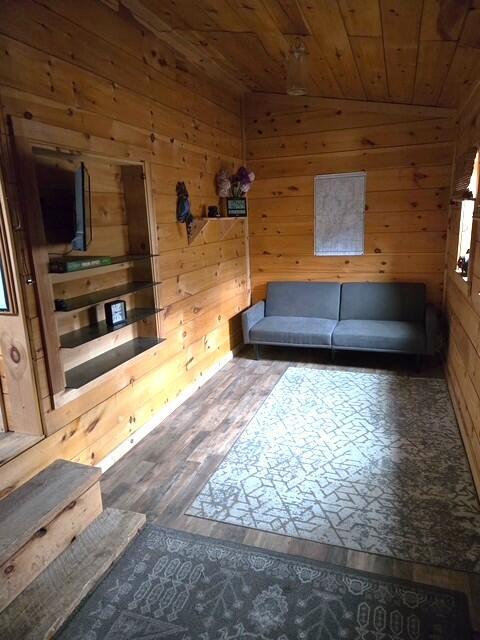 103 Fellows Ln, Winthrop, ME 04364 - living area with wood walls, wood ceiling, and wood finished floors