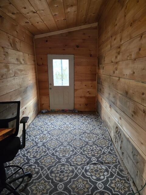 103 Fellows Ln, Winthrop, ME 04364 - interior space with wood walls, wood ceiling, vaulted ceiling, and ornamental molding